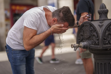 A man cool off in a fountain during a hot and sunny day of summer in Madrid, Spain, July 19, 2023. AP/RSS Photo